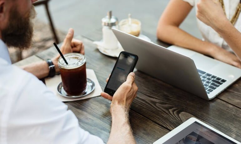 Business meeting, laptop and phone