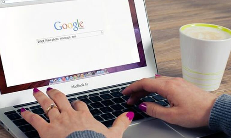 woman typing on laptop