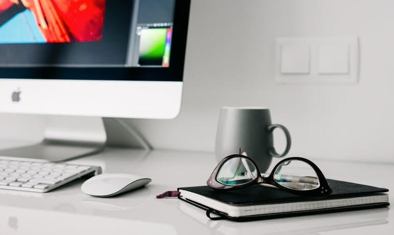 Mac laptop with reading glass