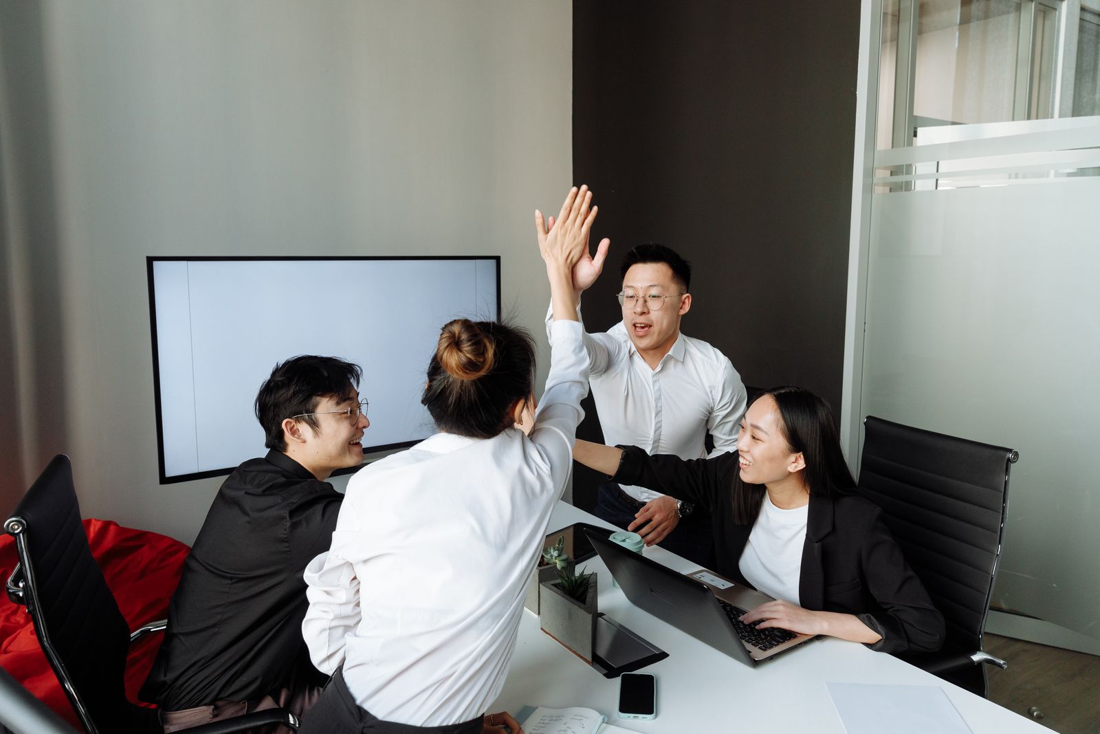 Reseller hosting agency team celebrating a client launch